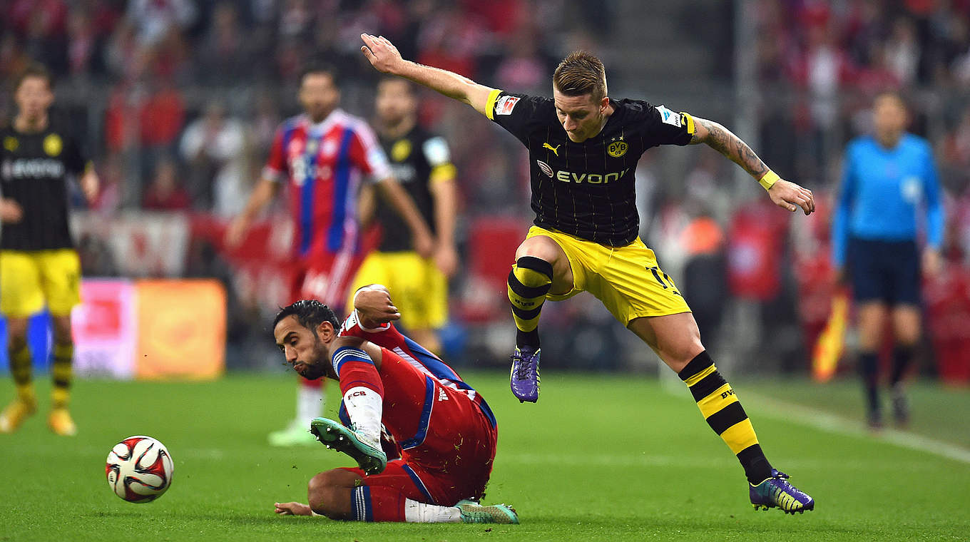 Kampf um den Ball: Mehdi Benatia (li.) und Marco Reus (r.) © 2014 Getty Images