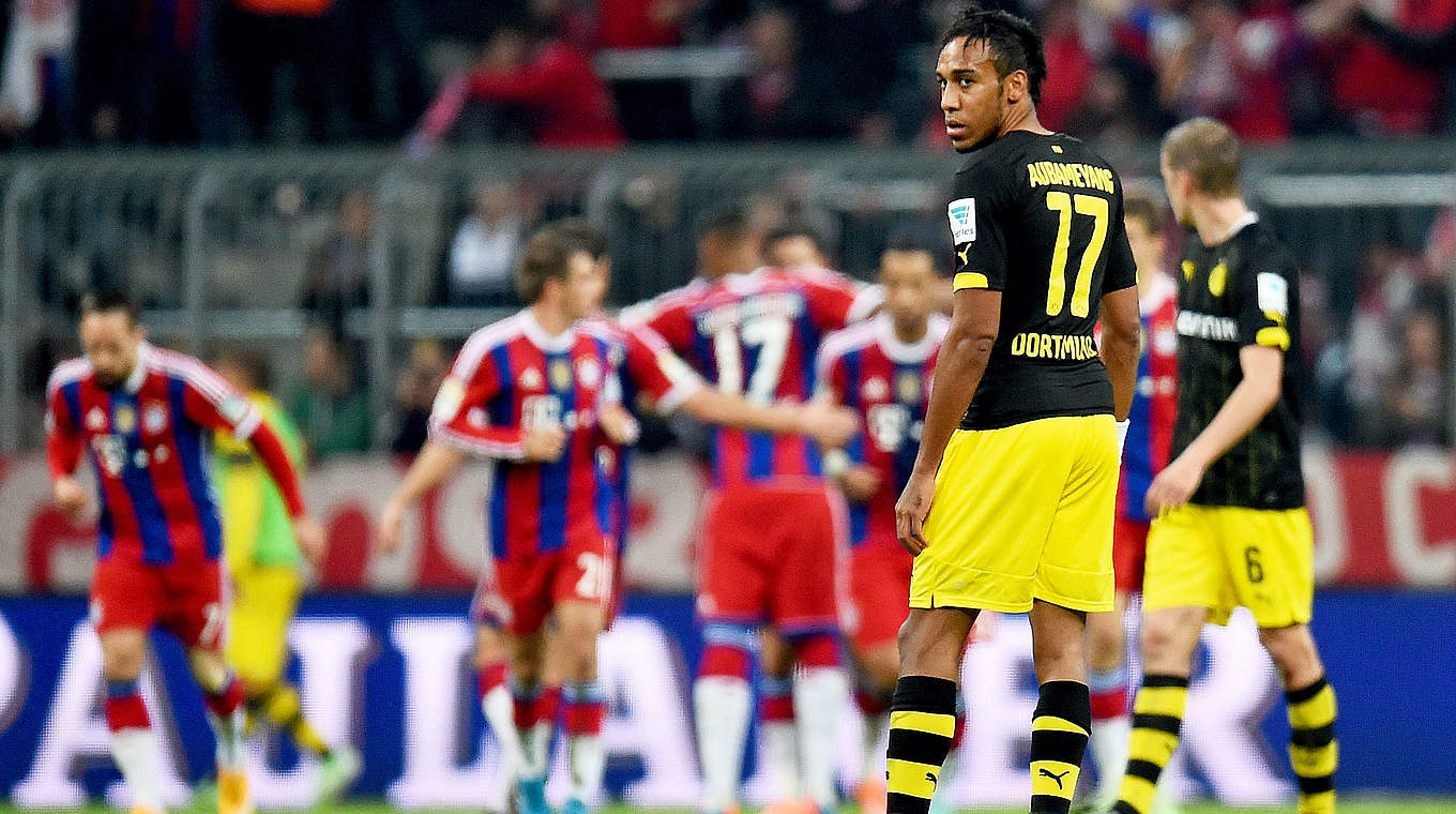 Zwei Gefühltswelten: jubelnde Bayern und geknickte Dortmunder © 2014 Getty Images