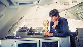 Löw and he trophy on the plane home © Paul Ripke
