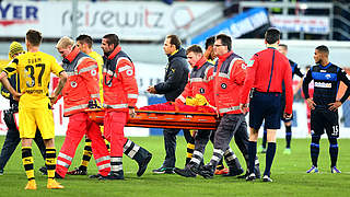 Reus was carried from the pitch on a stretcher © 2014 Getty Images