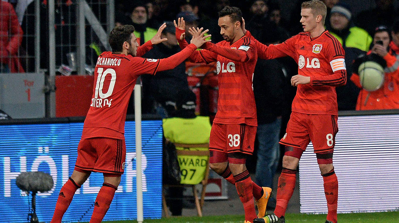 Karim Bellarabi and Hakan Calhanoglu celebrate a derby win with Bayer 04 © 2014 Getty Images
