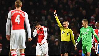 Captain Mertesacker watches on as his teammate Giroud is sent off © Getty Images