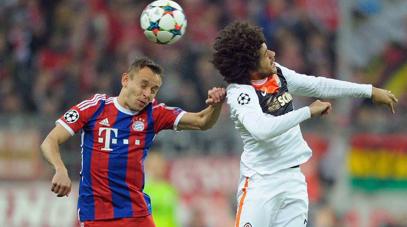 Rafinha and Shakhtar's Taison battling for the ball in the air © 2015 Getty Images