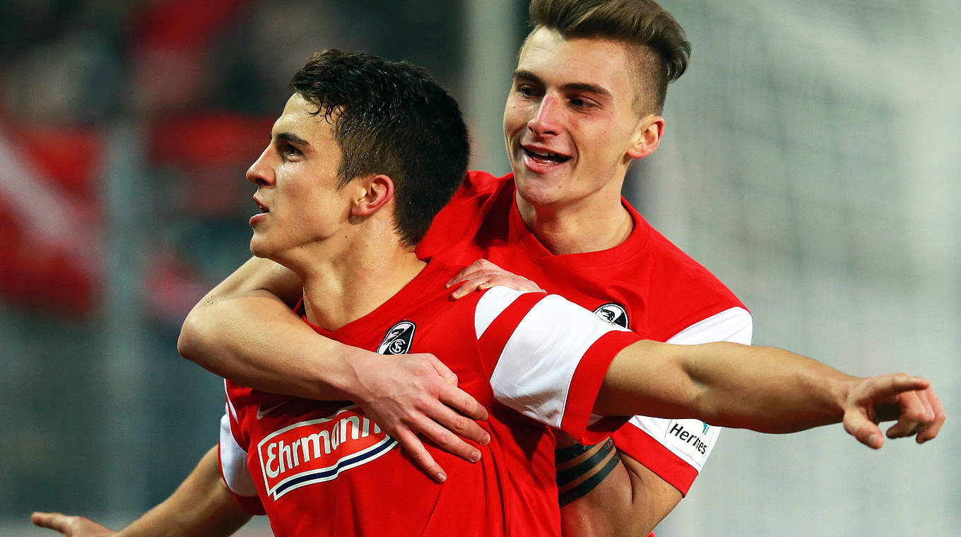 Marc-Oliver Kempf celebrates with teammate Maximilian Philipp © 2014 Getty Images