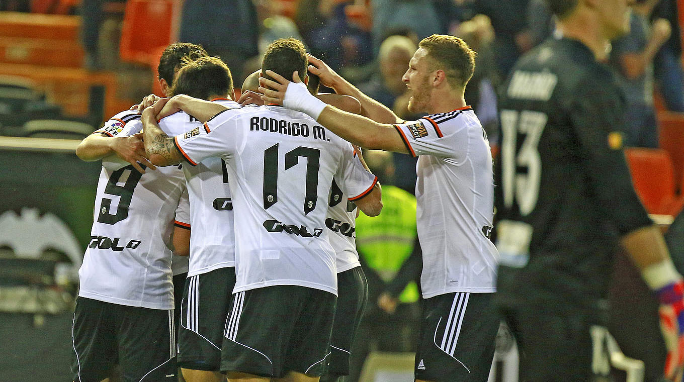 Mustafi and Valencia celebrate their win, which extends their unbeaten run to 10 games © 