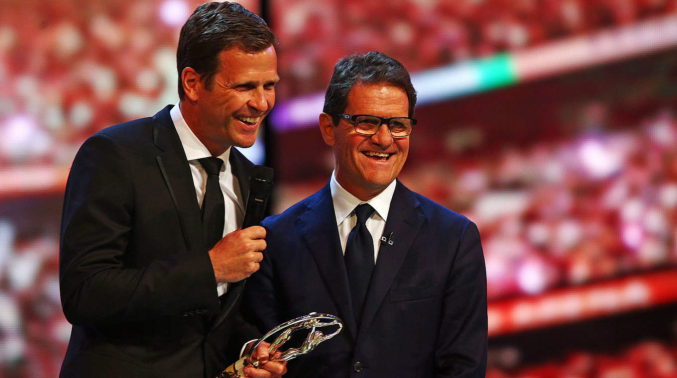 Fabio Capello hands over the award to Oliver Bierhoff in Shanghai © 2015 Getty Images