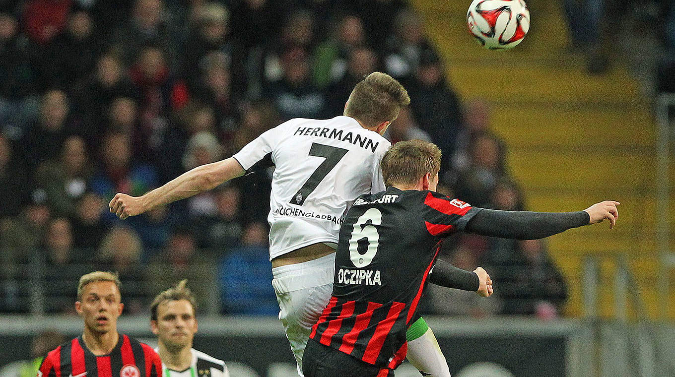 Borussia's Herrmann wins the aerial duel with Ockzipka © AFP/Getty Images