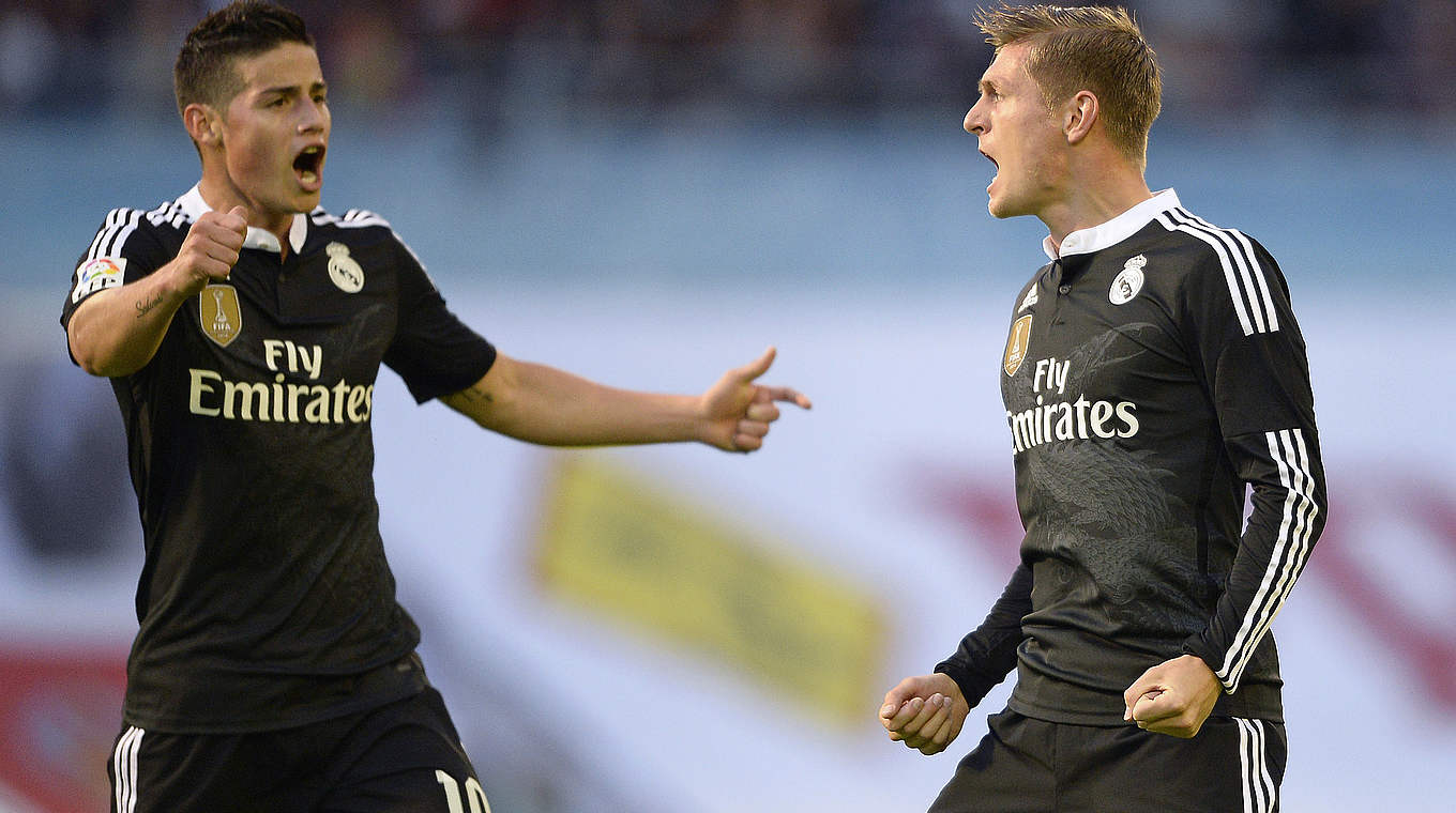 Goal scorers James Rodriguez and Toni Kroos celebrate together © 