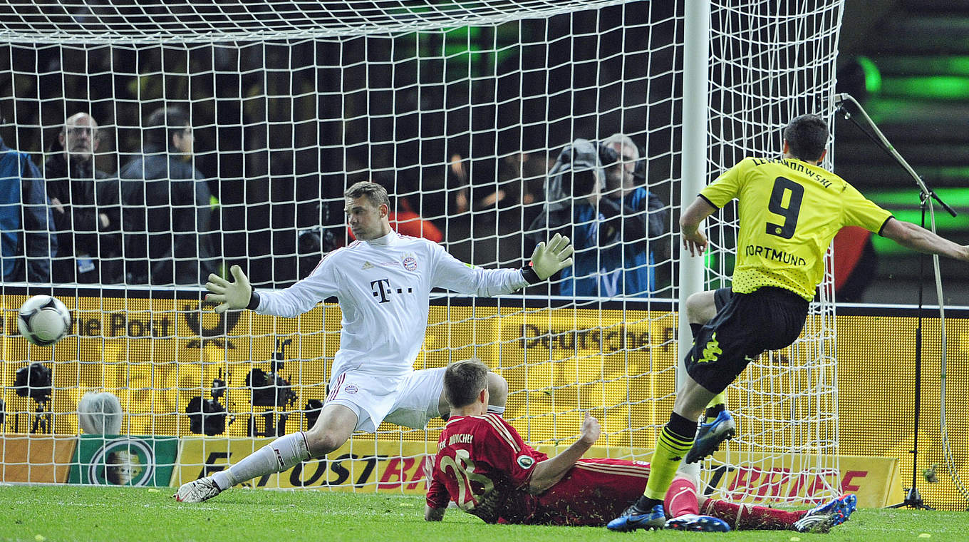 Lewandowski scores past Neuer in the 2012 final  © 2012 AFP