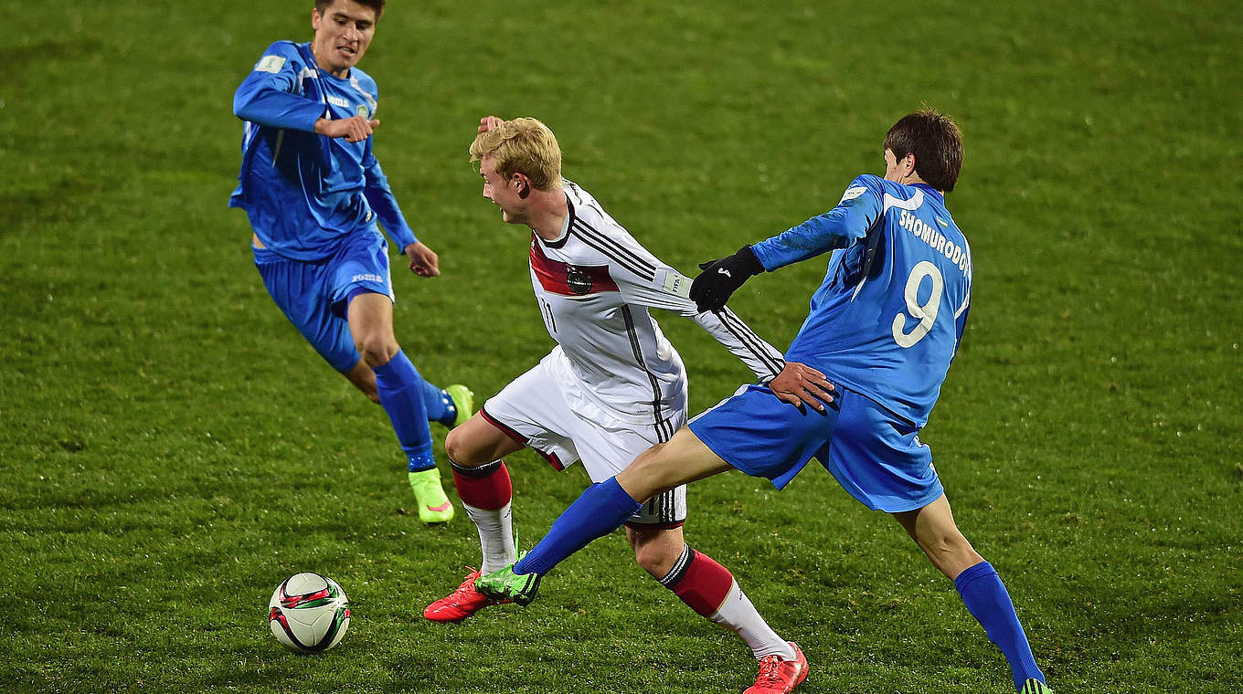 Julian Brandt asserting himself against two Uzbek players
 © 2015 FIFA
