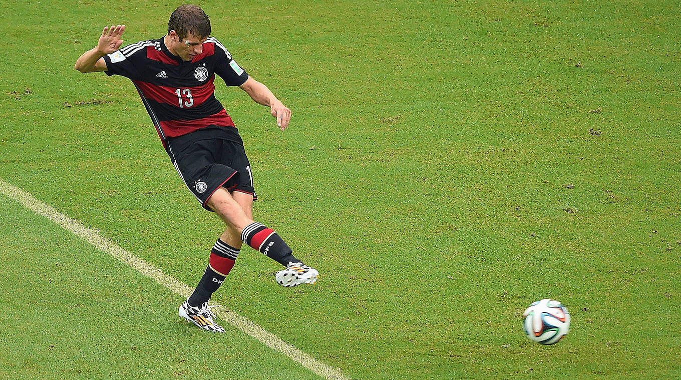 Thomas Müller seals the win for Germany with this beauty © 2014 Getty Images