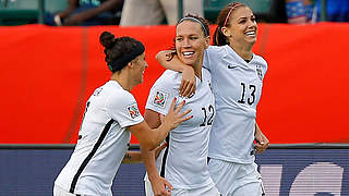 Alex Morgan and her teammates celebrate the opening goal © 2015 Getty Images