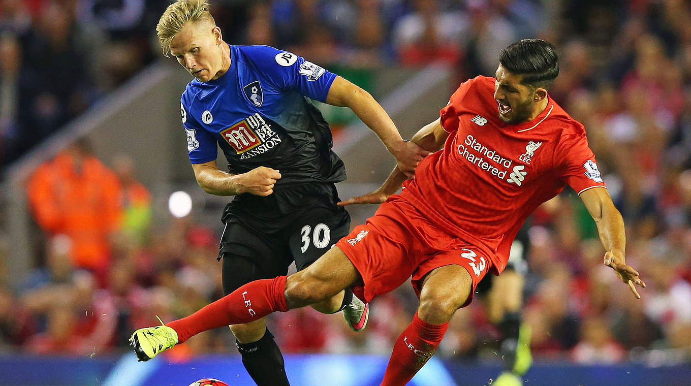 Liverpool's Can and Bournemouth's Matt Ritchie challenge for the ball © 2015 Getty Images
