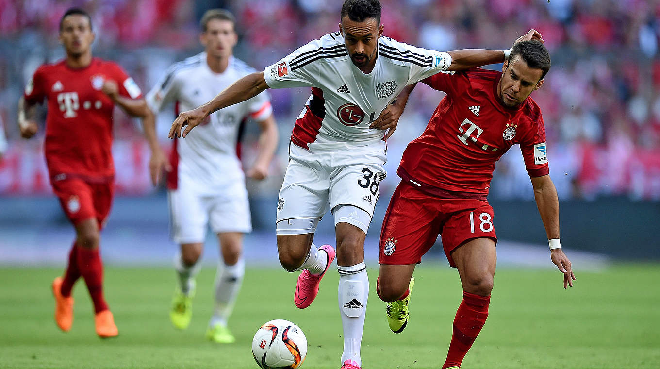 Leverkusen's Karim Bellarabi (left) battling with Juan Bernat © 2015 Getty Images