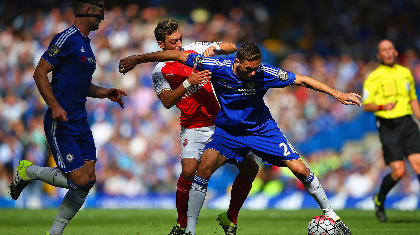 Özil in a possession battle with Chelsea's Nemanja Matic © 2015 Getty Images