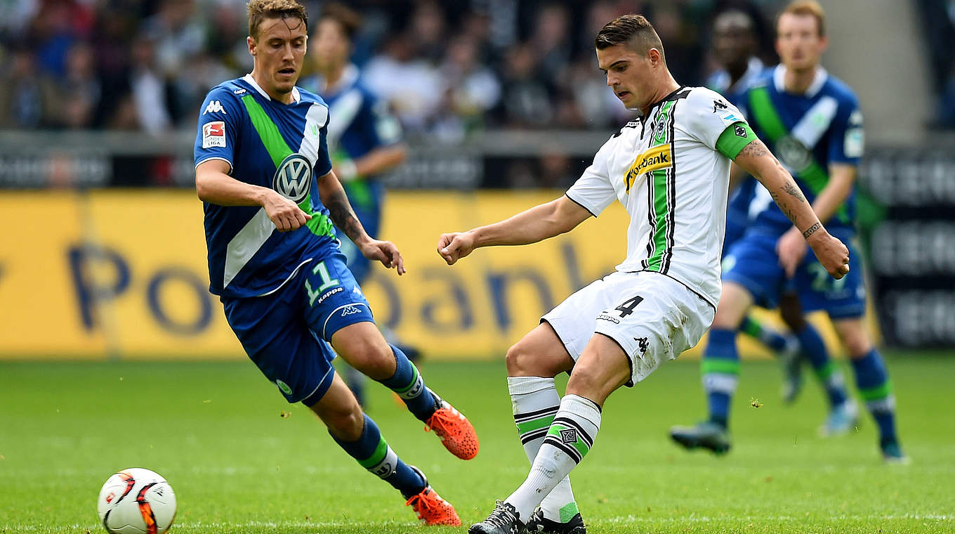 Max Kruse battling for the ball with Granit Xhaka. © 2015 Getty Images