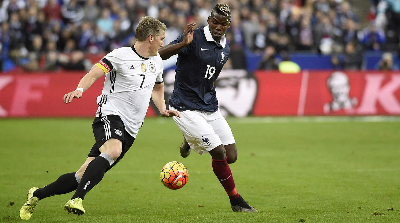 Bastian Schweinsteiger and Paul Pogba challenge for the ball © 