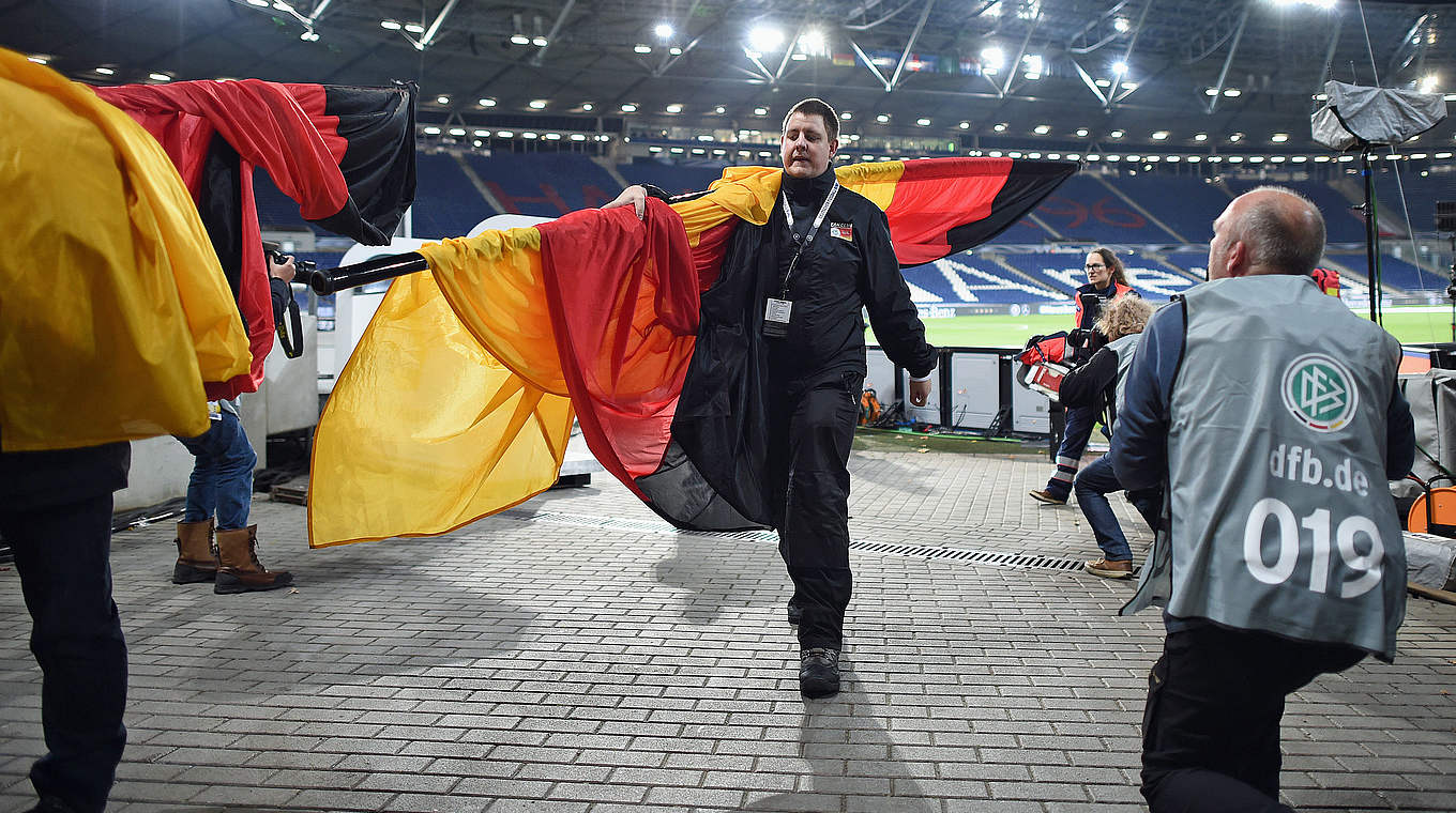 The flags are removed from the stadium following the evacuation © 2015 Getty Images