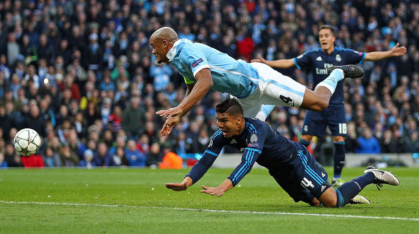 Vincent Kompany battling with Casemiro for the ball © 2016 Getty Images