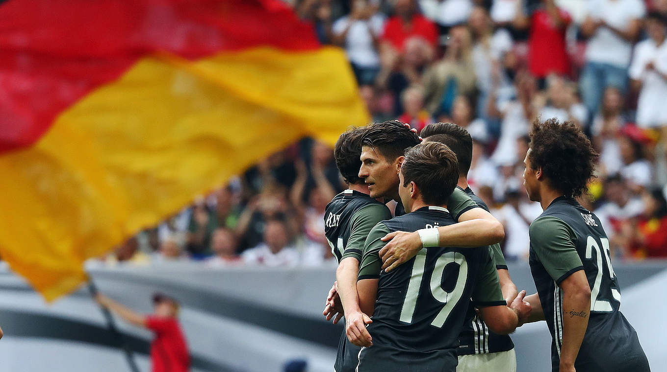 Germany celebrate taking the lead through Mario Gomez.  © 2016 Getty Images