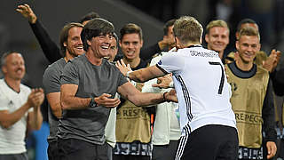 Löw celebrates with Schweinsteiger: 