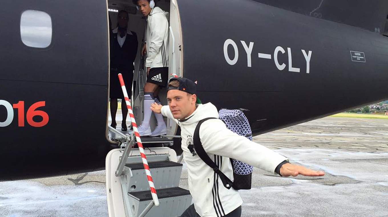 Manuel Neuer boarding the plane with his teammates as they set sail for Lille © 