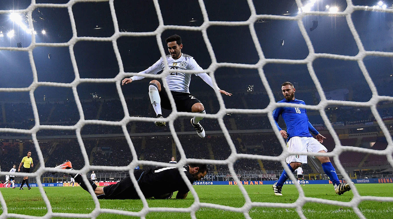 Italian keeper Buffon just gets to the ball ahead of Gündogan © 2016 Getty Images