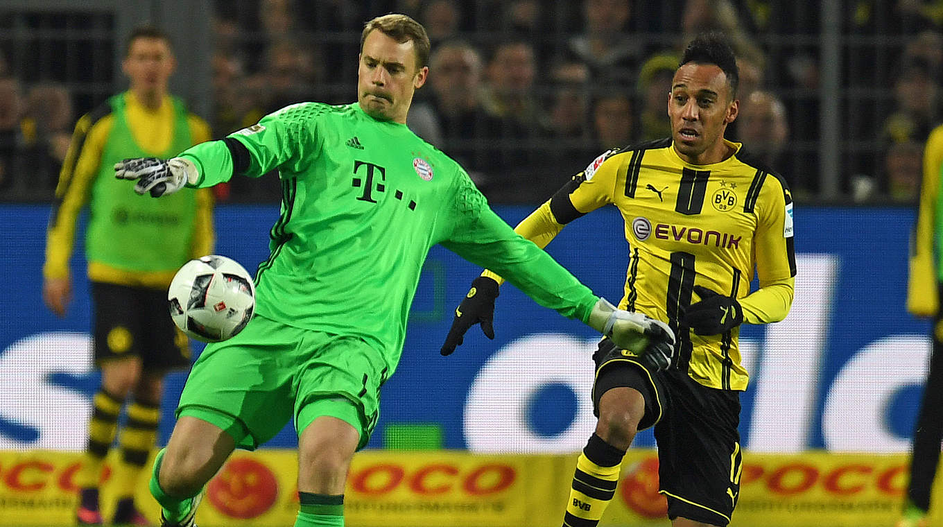 Manuel Neuer comes out to beat Pierre-Emerick Aubameyang to the ball  © This content is subject to copyright.