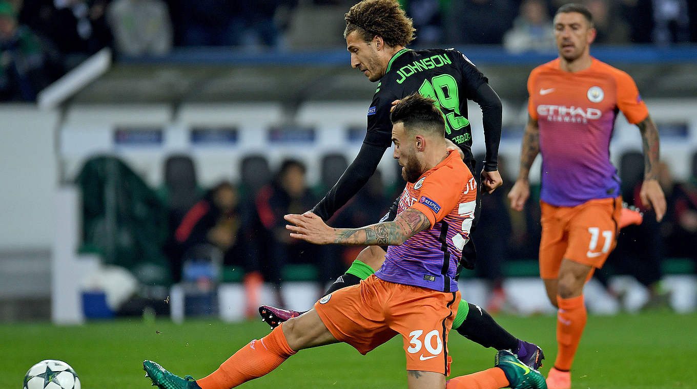 Man City centre-back Nicolas Otamendi challenges Gladbach winger Fabian Johnson © AFP/Getty Images