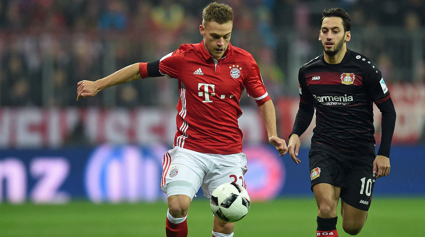 Joshua Kimmich gets the ball just ahead of Hakan Calhanoglu. © This content is subject to copyright.