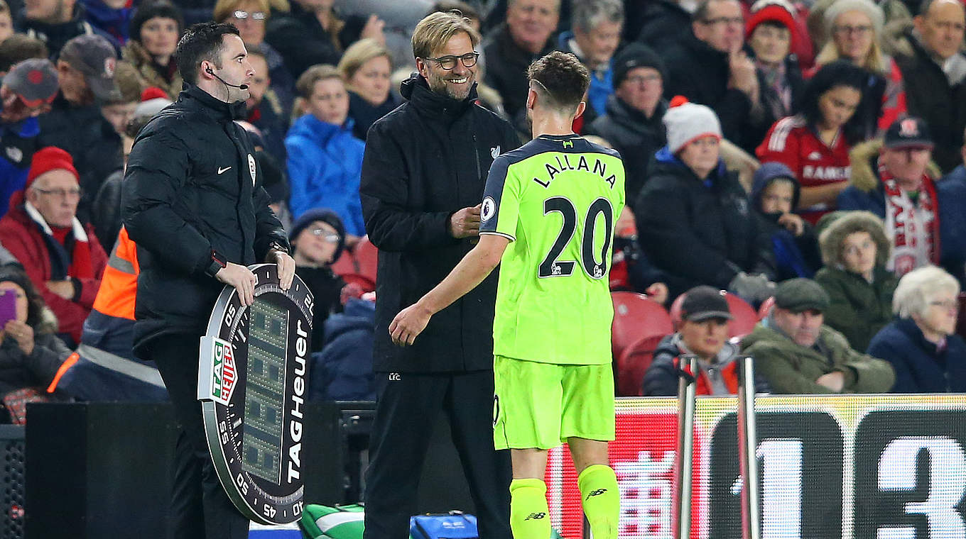 Liverpool coach Klopp congratulates Adam Lallana on his brace © 2016 Getty Images