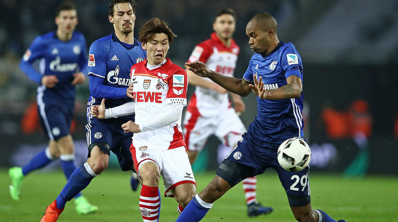 Schalke centre-back Naldo stops Köln forward Yuya Osako in his tracks. © 2017 Getty Images