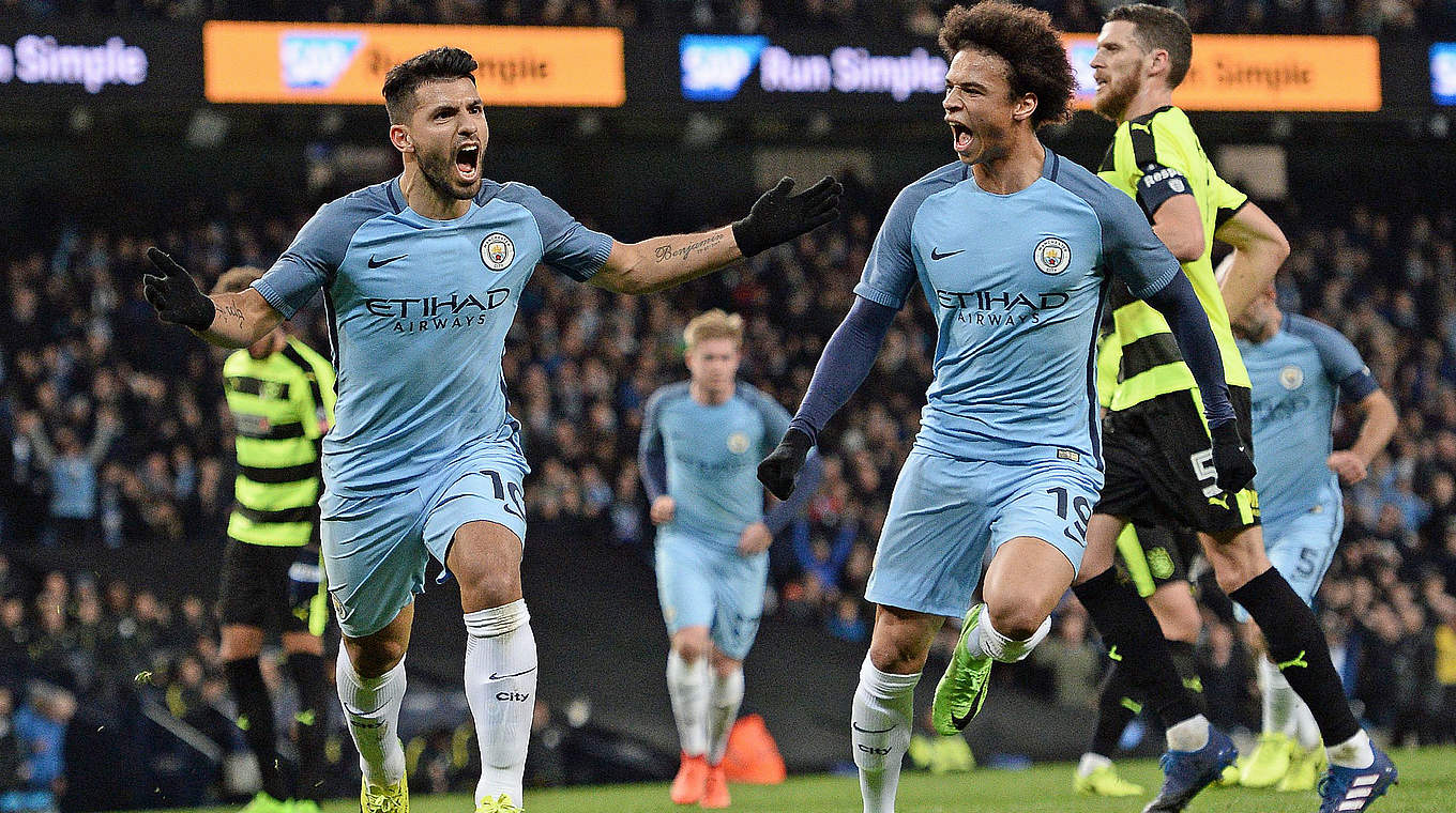 Sané celebrates with fellow goalscorer Sergio Aguero © AFP/Getty Images