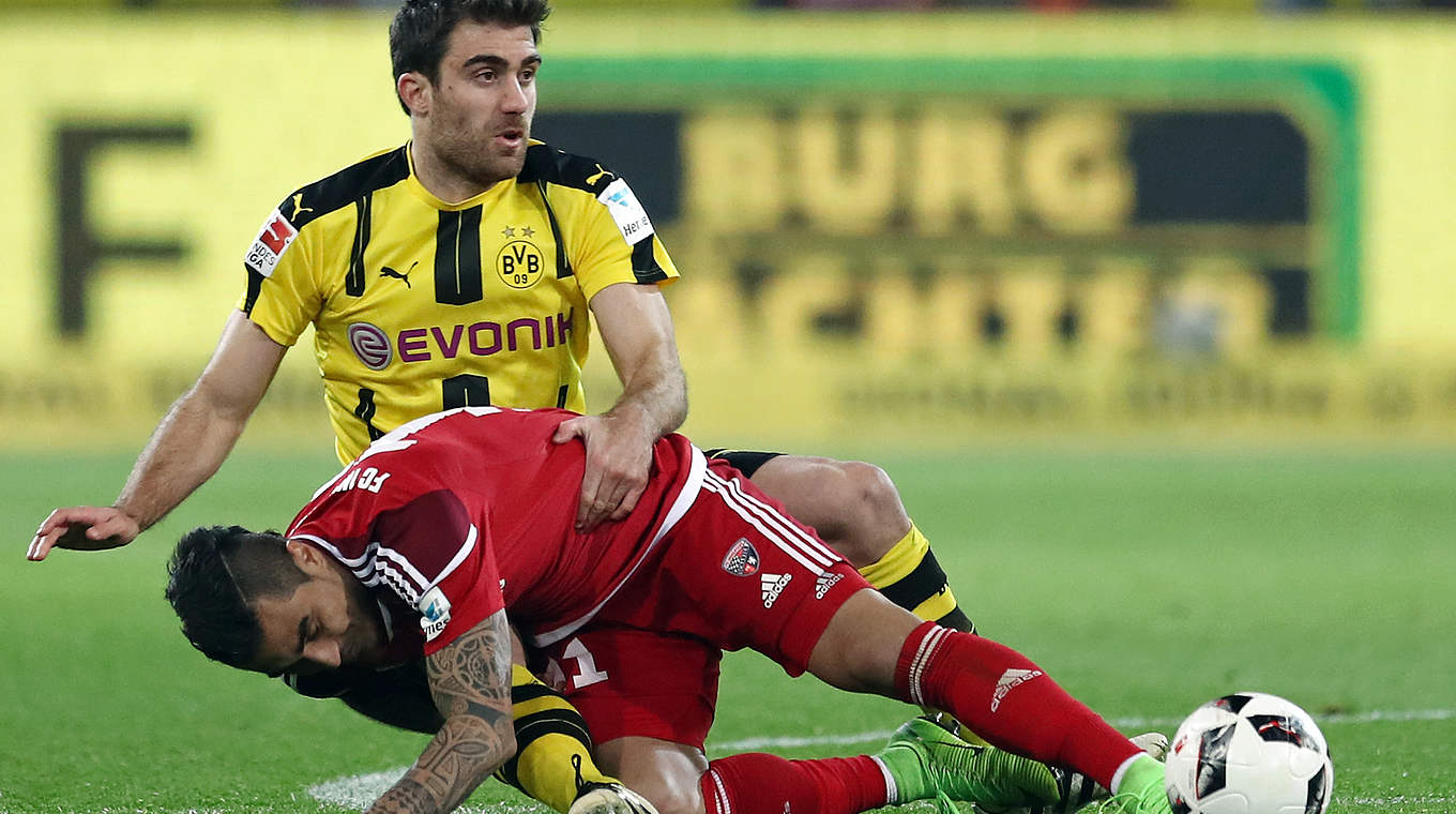 Dortmund's Sokratis goes in for a challenge with Lezcano of Ingolstadt.  © 2017 Getty Images