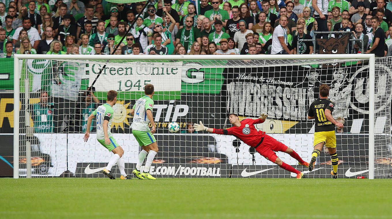 The Dortmund opener: Mario Götze (right) watches on as Christian Pulisic's shot hits the back of the net © 2017 Getty Images