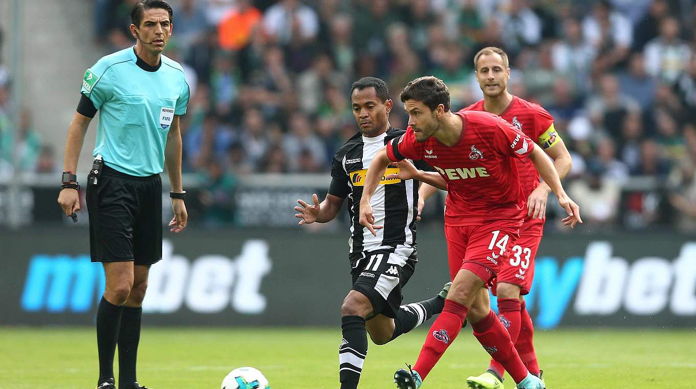 Focussed: Köln's international, Jonas Hector (right) plays the ball forward © 2017 Getty Images