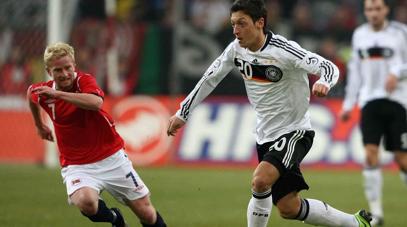 Özil (right) made his debut for the national side against Norway in 2009 © 2009 Getty Images