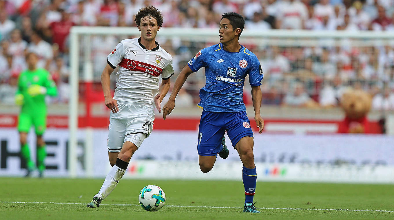 Benjamin Pavard and Yoshinori Muto battle in the two sides' meeting on matchday 2 © 2017 Getty Images