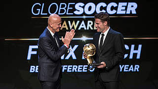 Brych received his award from Pierluigi Collina in Dubai. © 2017 Getty Images