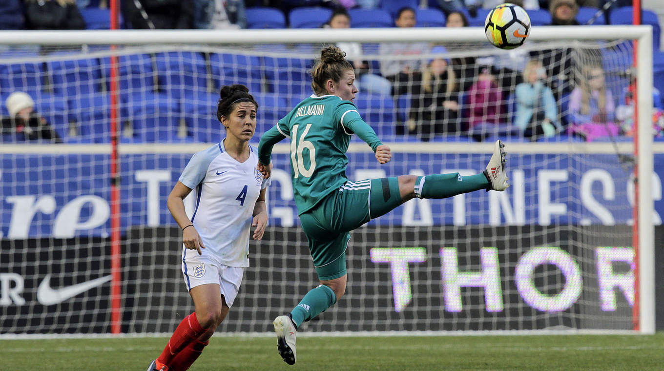 Linda Dallmann beats England's Williams to the ball © This content is subject to copyright.