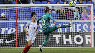 Linda Dallmann beats England's Williams to the ball © This content is subject to copyright.
