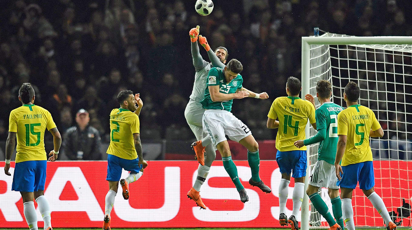 Mario Gomez is beaten to the ball by Brazil goalkeeper Alisson. © AFP/Getty Images