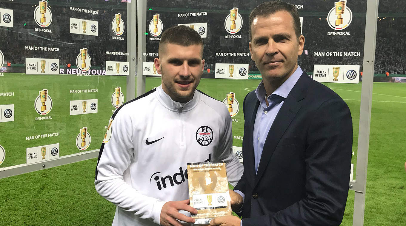 Rebic (left) was presented the Man of the Match prize by Oliver Bierhoff © 