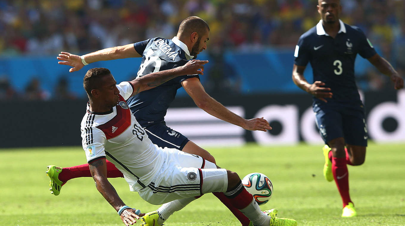 Jerome Boateng grapples with France's Karim Benzema during a tight quarter final © 2014 Getty Images