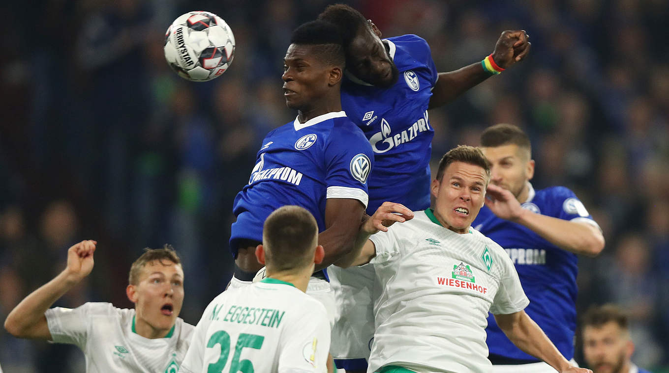 Schalke's Breel Embolo and Salif Sané (top right) go for a header.  © Getty Images