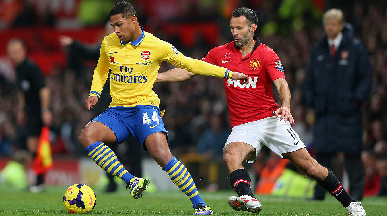 In action against Ryan Giggs for Arsenal.  © 2013 Getty Images