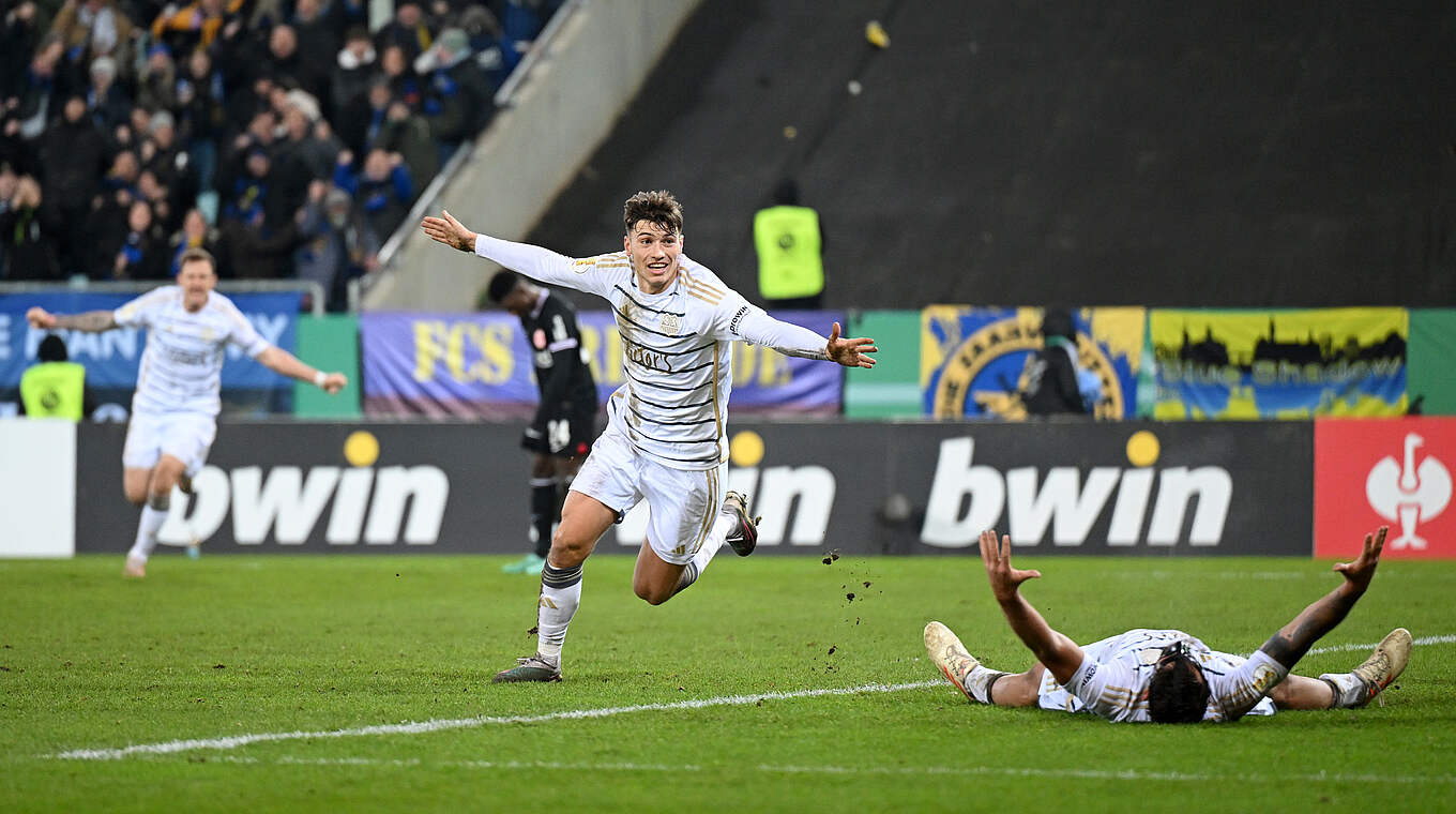 Luca Kerber celebrating his goal as underdogs Saarbrücken secure 2-0 win © 2023 Getty Images