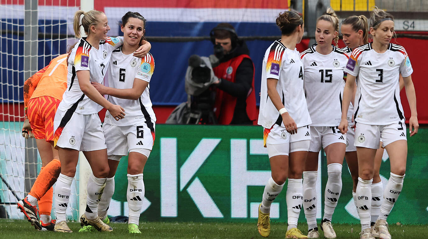 Germany celebrate Oberdorf's goal to make it 3-1. © 