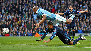 Vincent Kompany battling with Casemiro for the ball © 2016 Getty Images