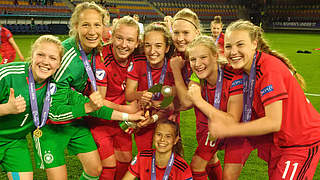 Beaming faces and unbridled joy: Germany with the trophy  © DFB